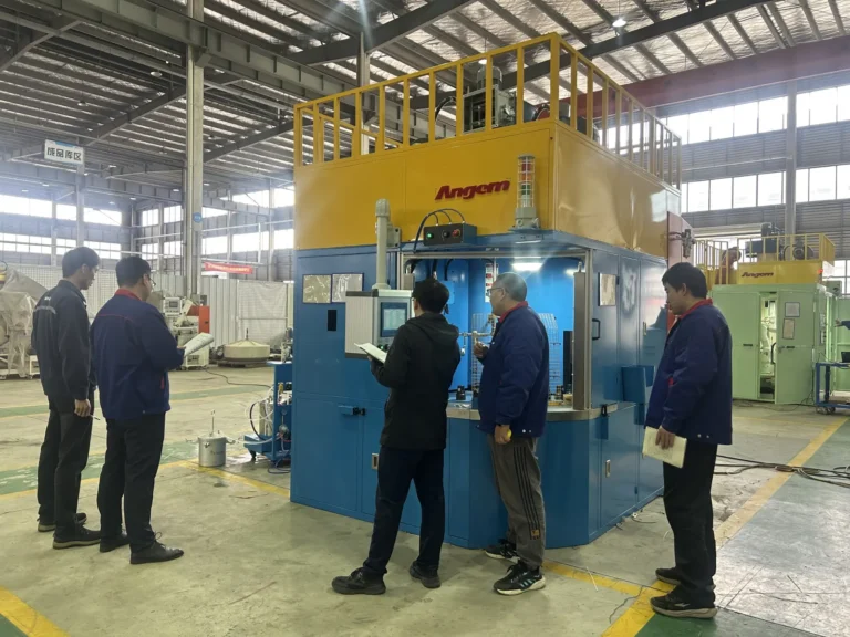 Tenneco conducting factory acceptance testing of Angem's automatic adhesive spray coating machine