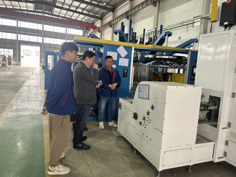 Japanese rubber anti-vibration parts manufacturer visiting Angem to inspect the automatic roll coating machine